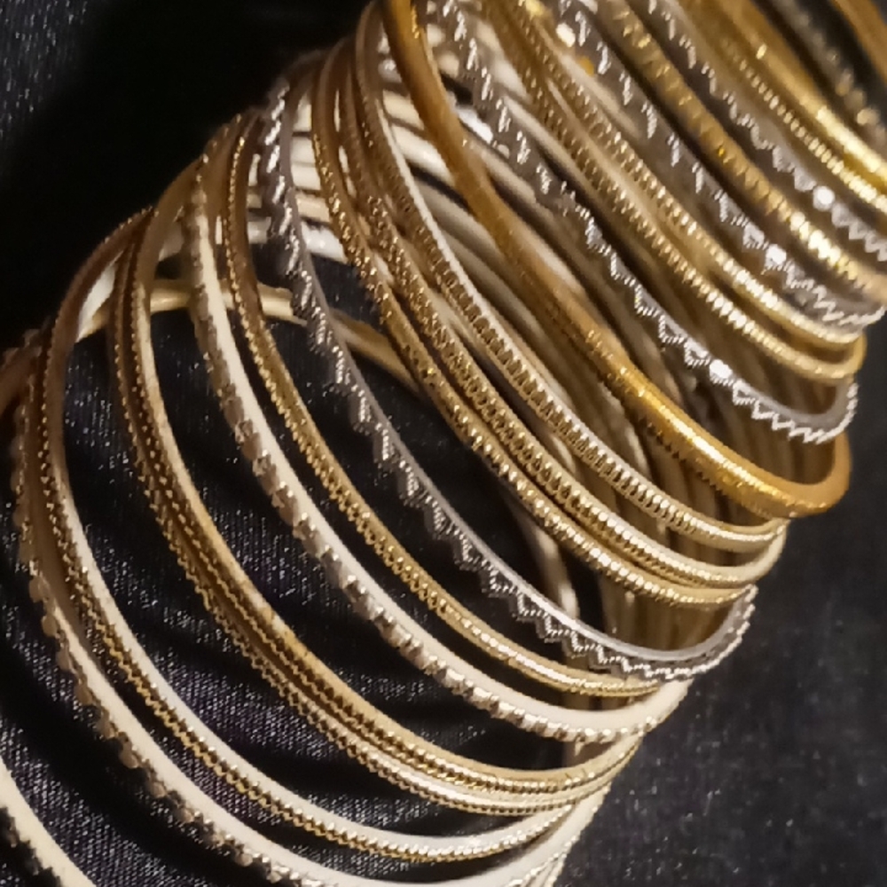 Child's girls small Gold and Silver Bangle 20 in all . 2.25 across